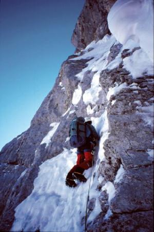 Martin on the thin section leading to the overhanging headwall which is visible at the top of the picture